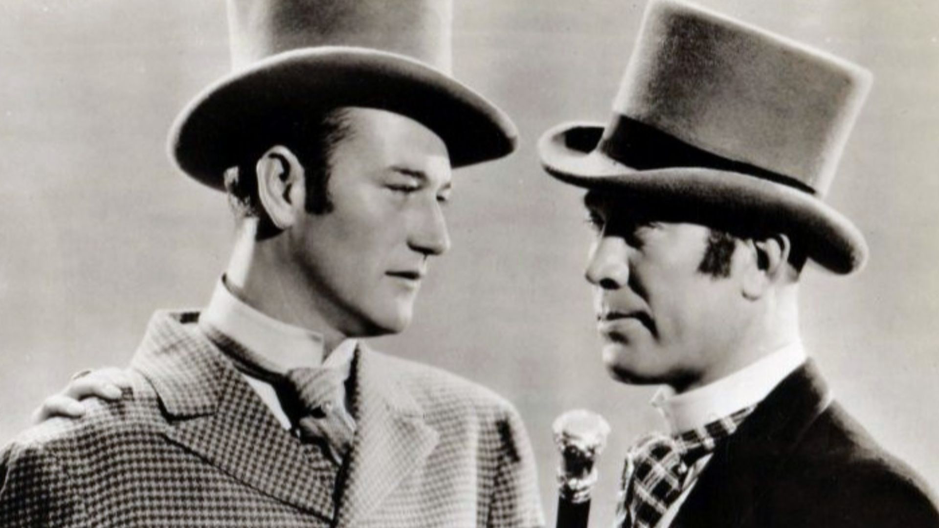 L. to R. : Jean Rogers, John Wayne & Ward Bond in Conflict - publicity still (cropped)