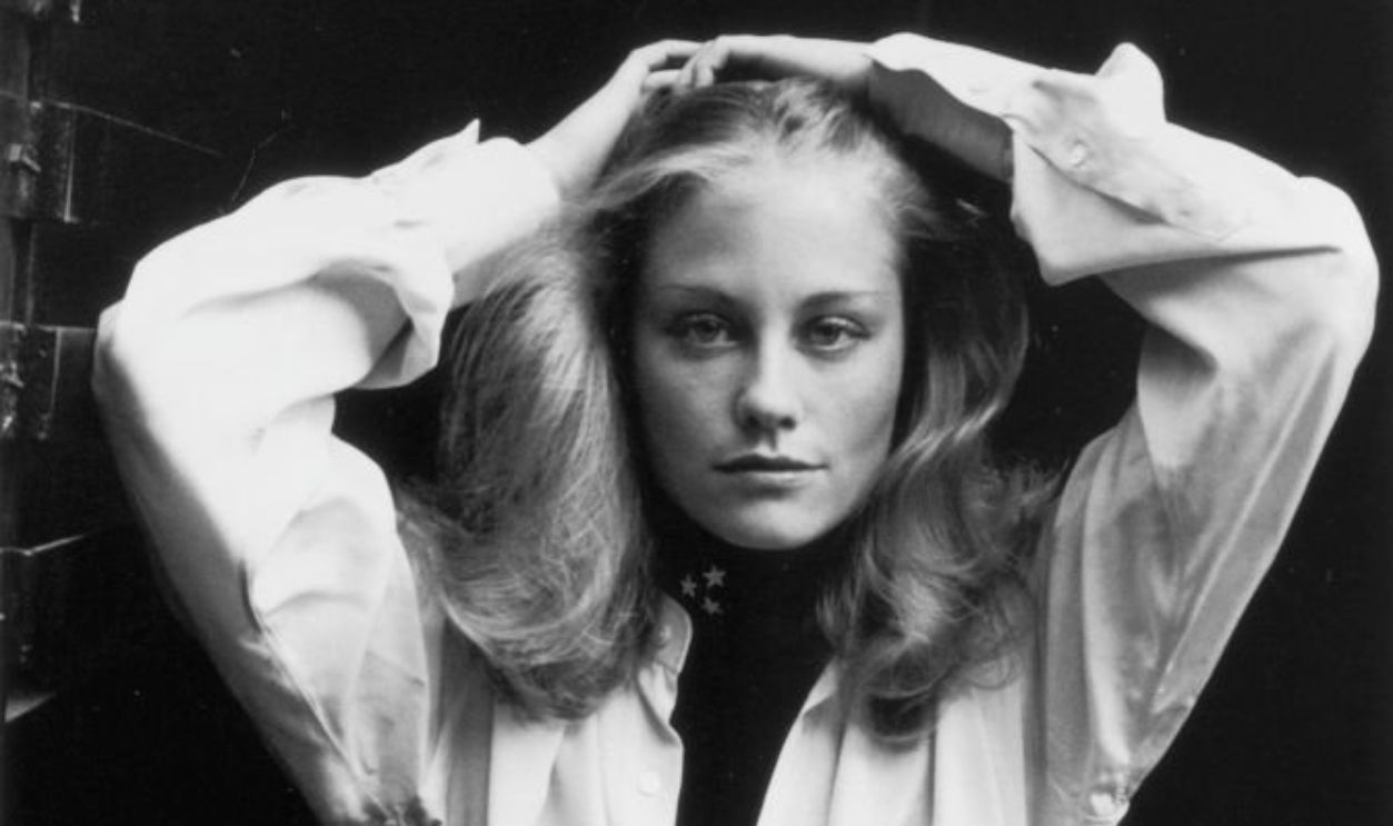 27th October 1971: Portrait of American actor and model Cybill Shepherd posing in a doorway with her hands behind her head, New York City. She wears a white blouse.