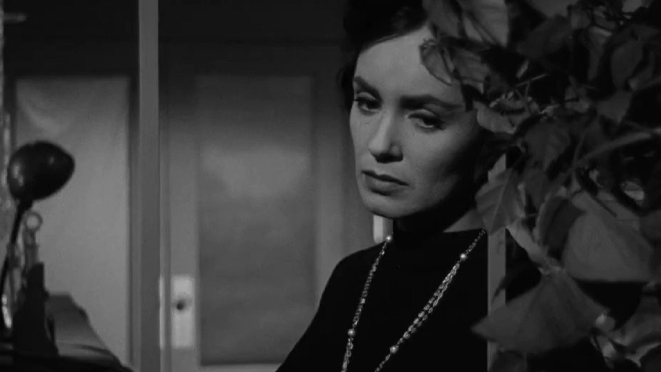 Susan Cabot  wearing black dress is looking sad - from The Wasp Woman (1959)