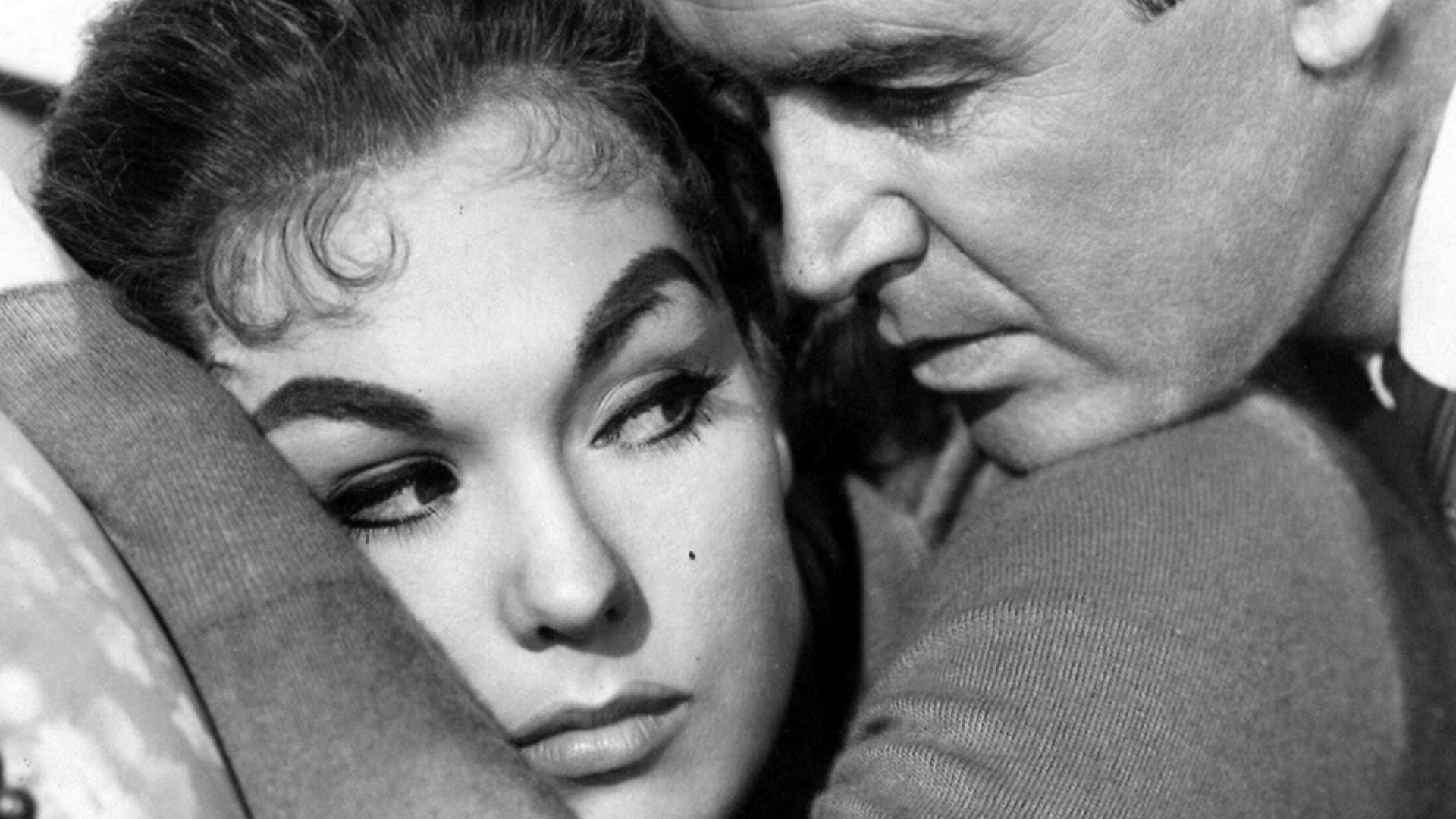 Photo of Kim Novak & James Stewart from the film Vertigo (1958). See also film still. No copyright notice.
