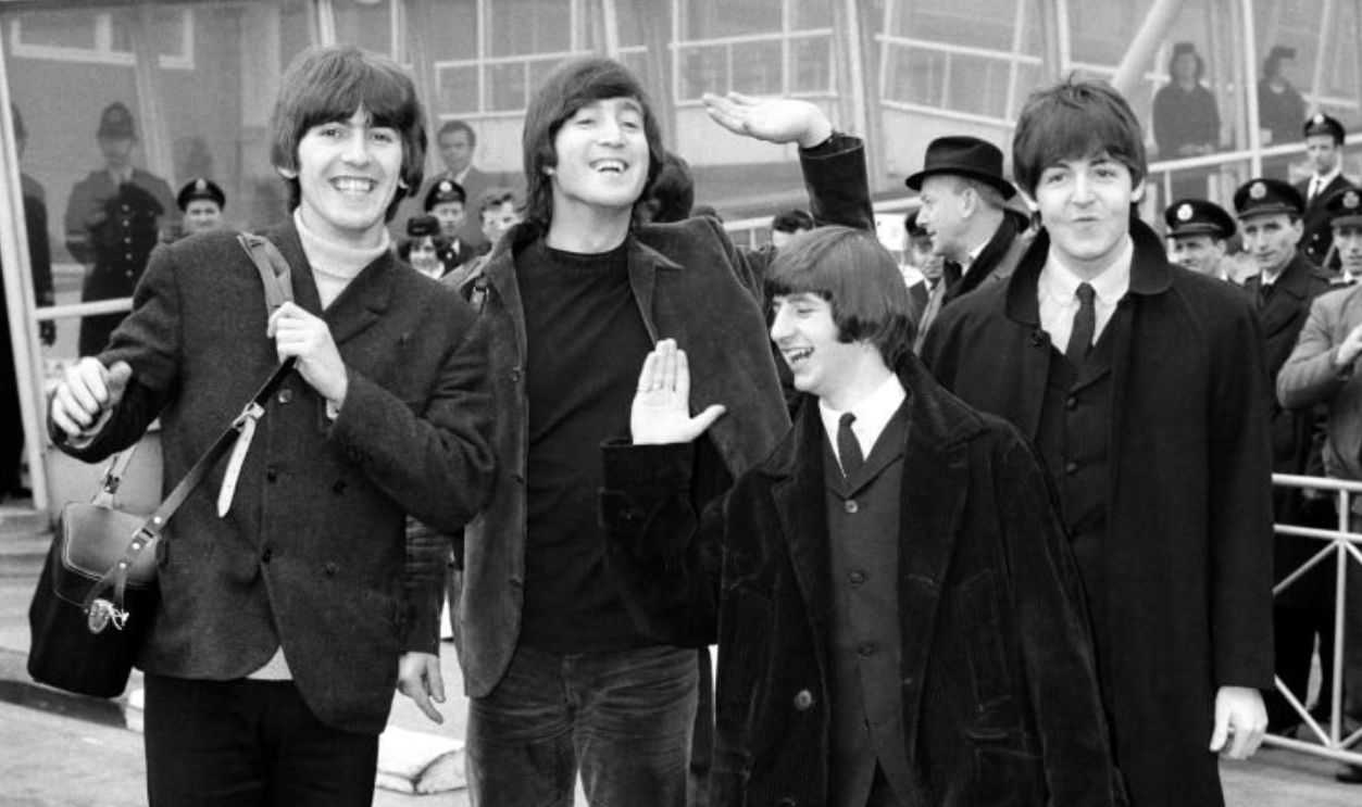 The Beatles leave London Airport bound for the Bahamas to commence filming on their second movie, Help!, 22 February 1965. Left to right: George Harrison, John Lennon, Ringo Starr and Paul McCartney. 