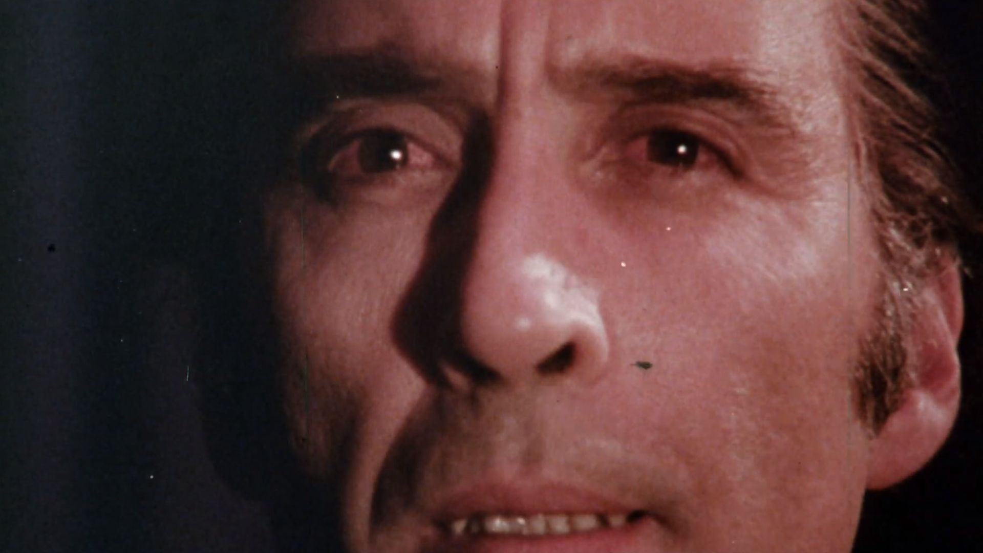 A screenshot of Christopher Lee as Count Dracula from the Hammer Film The Satanic Rites of Dracula (1973)