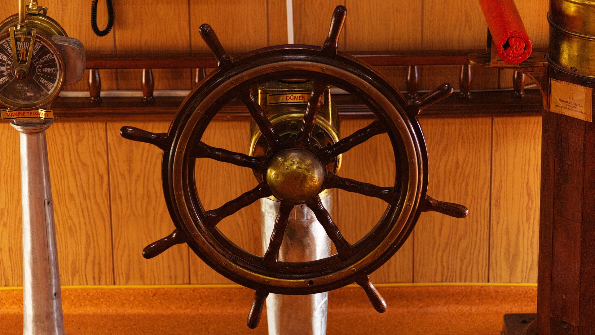 Close-up of a vintage ship helm and controls in a museum exhibit, İzmir.