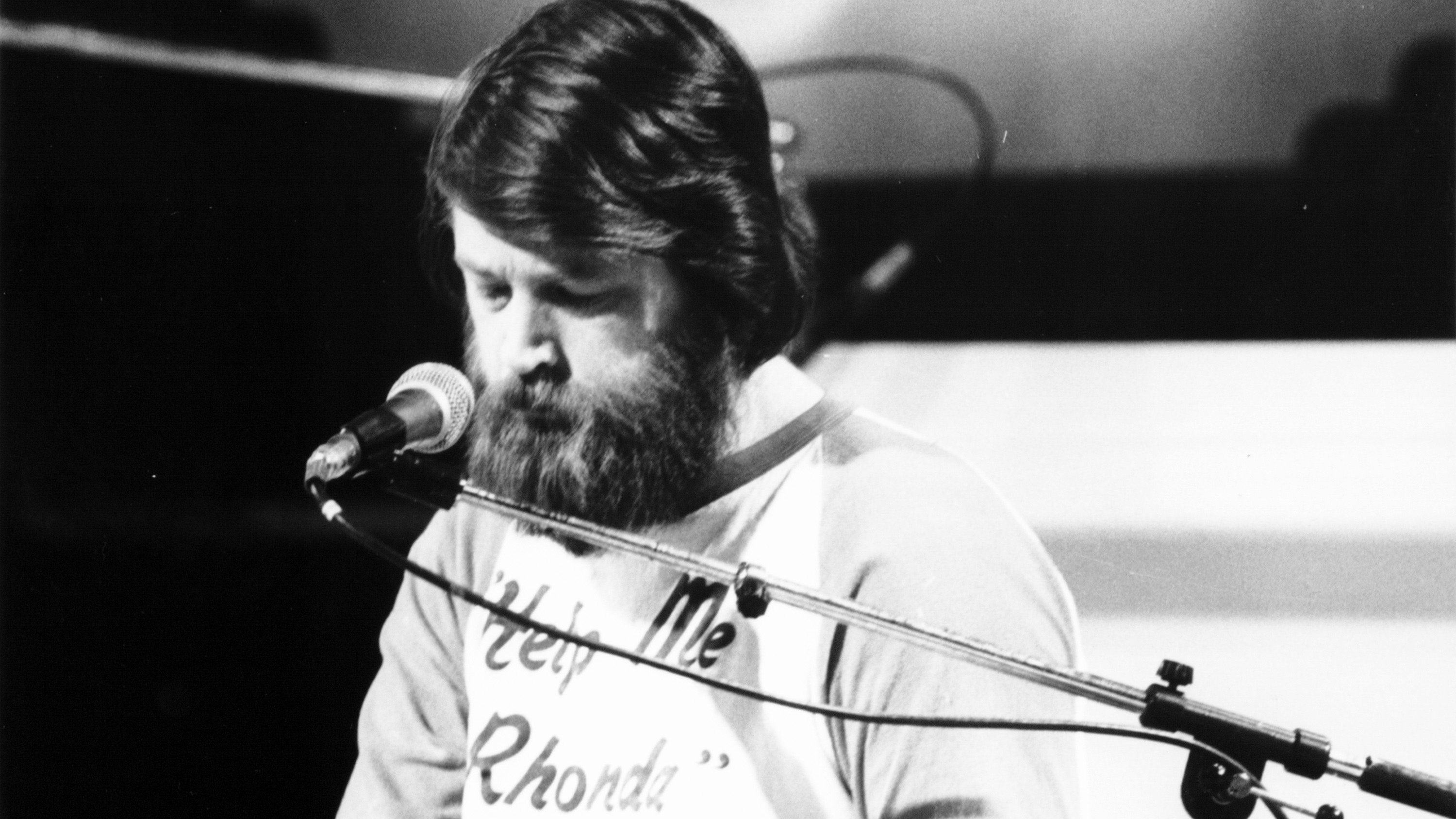 Beach Boys member Brian Wilson performing on stage