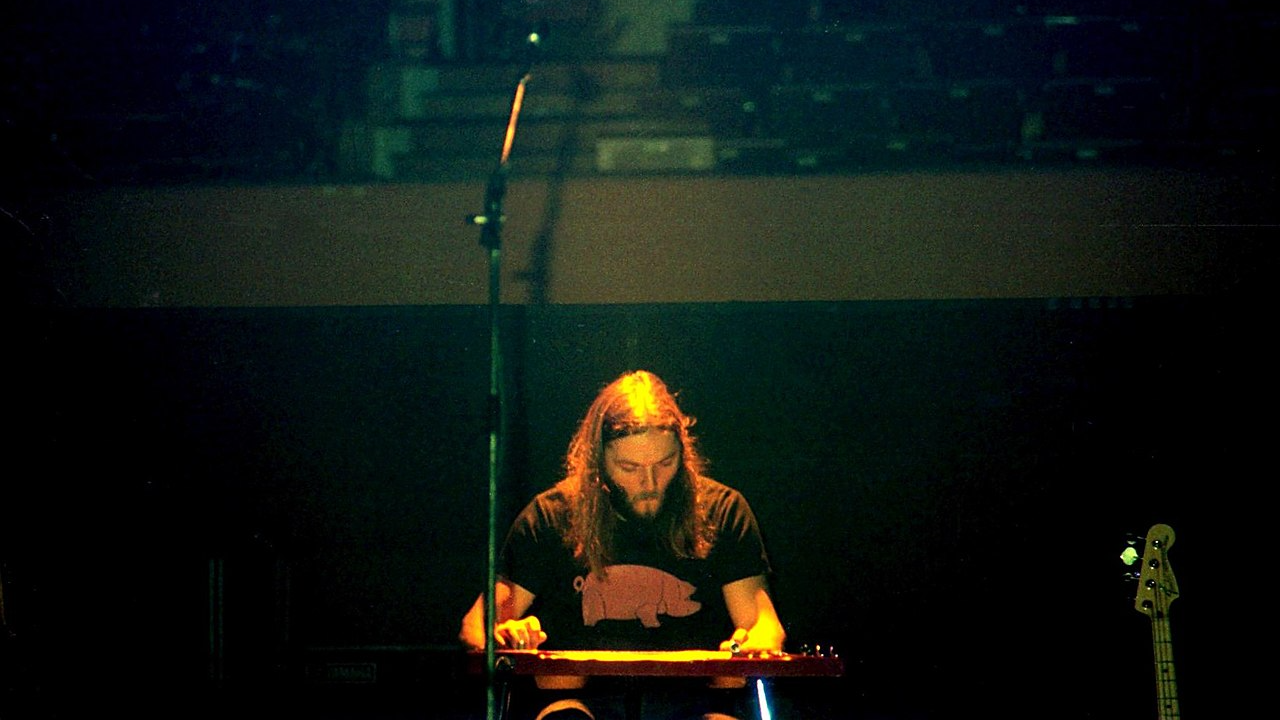 David Gilmour playing lap steel guitar with Pink Floyd,