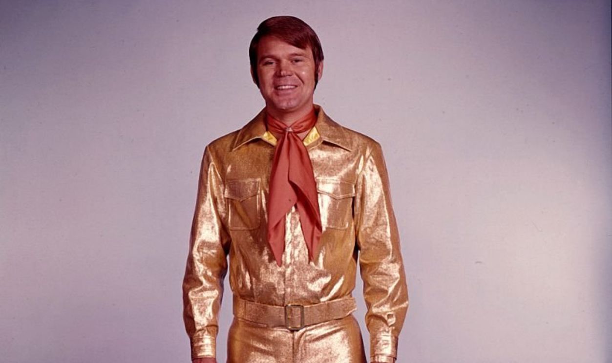 1967: Singer Glen Campbell poses for a portrait wearing a gold suit in circa 1967.
