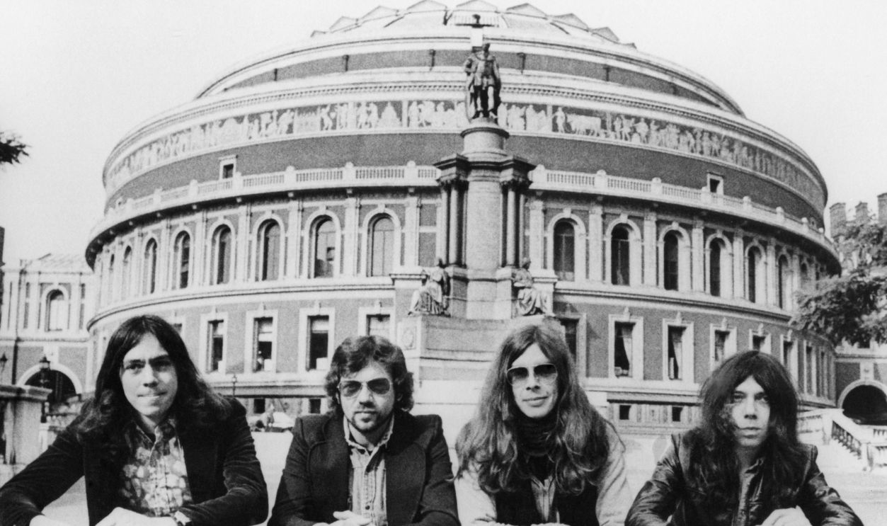 Getty Images - 1015094818 - English progressive rock band Camel (L-R Andy Latimer, Doug Ferguson, Andy Ward and Peter Bardens) pose for a Decca Records Publicity still outside The Royal Albert Hall circa 1975 in London, England.