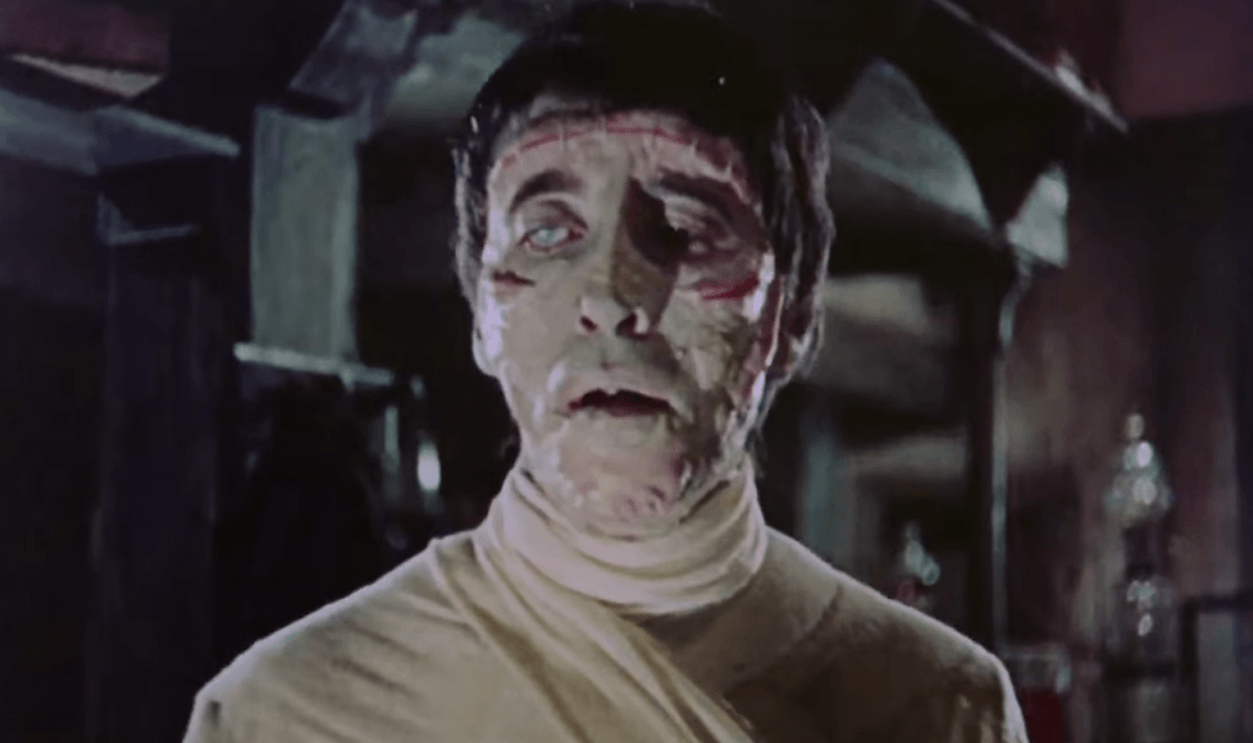 Screenshot of Christopher Lee as Frankenstein’s Monster in The Curse of Frankenstein (1957)