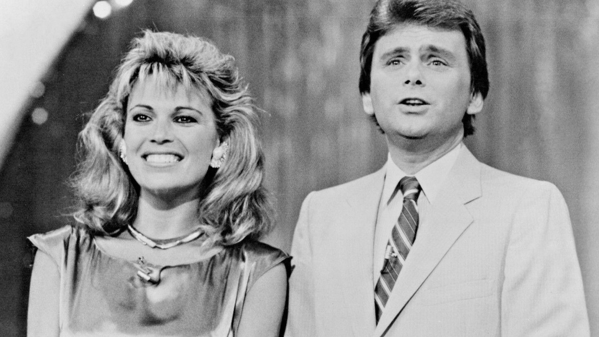 Photograph of Pat Sajak and Vanna White in a promo photo for the 86-87 season of Wheel of Fortune. This photo was sent out to fans by mail with signatures from the cast.