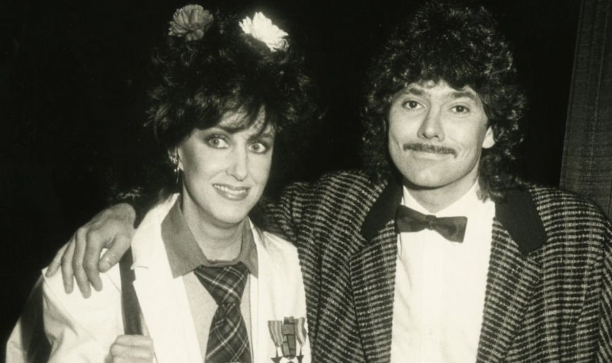 Singer Grace Slick and musician Mickey Thomas attending 12th Annual American Music Awards on January 28, 1985 at the Shrine Auditorium in Los Angeles, California.
