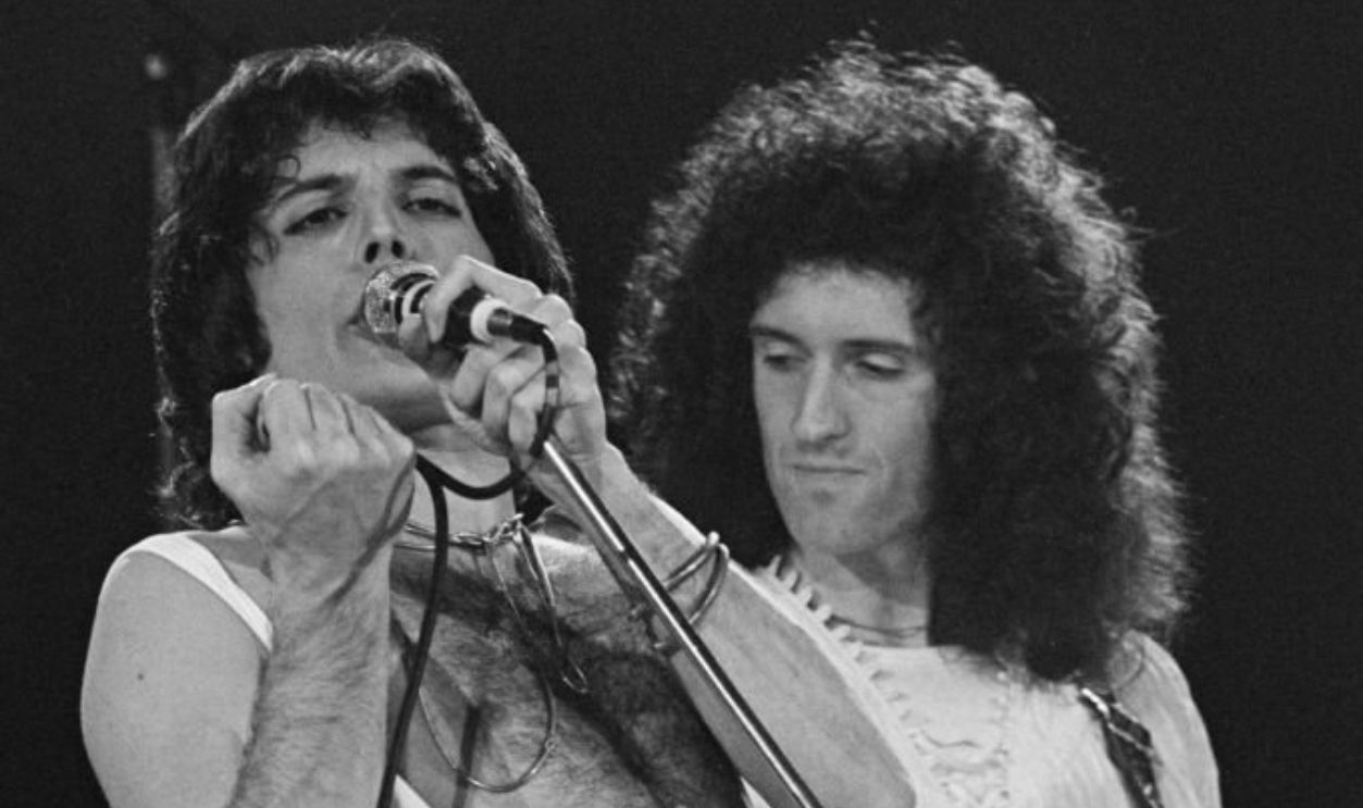 British singer and songwriter Freddie Mercury and British guitarist and songwriter Brian May, playing his 'Red Special' guitar, as British rock band Queen perform in concert at the Forum in Inglewood, California, March 1977. Queen played two dates at The Forum, 2nd and 3rd March, during their 'A Day at the Races' tour.