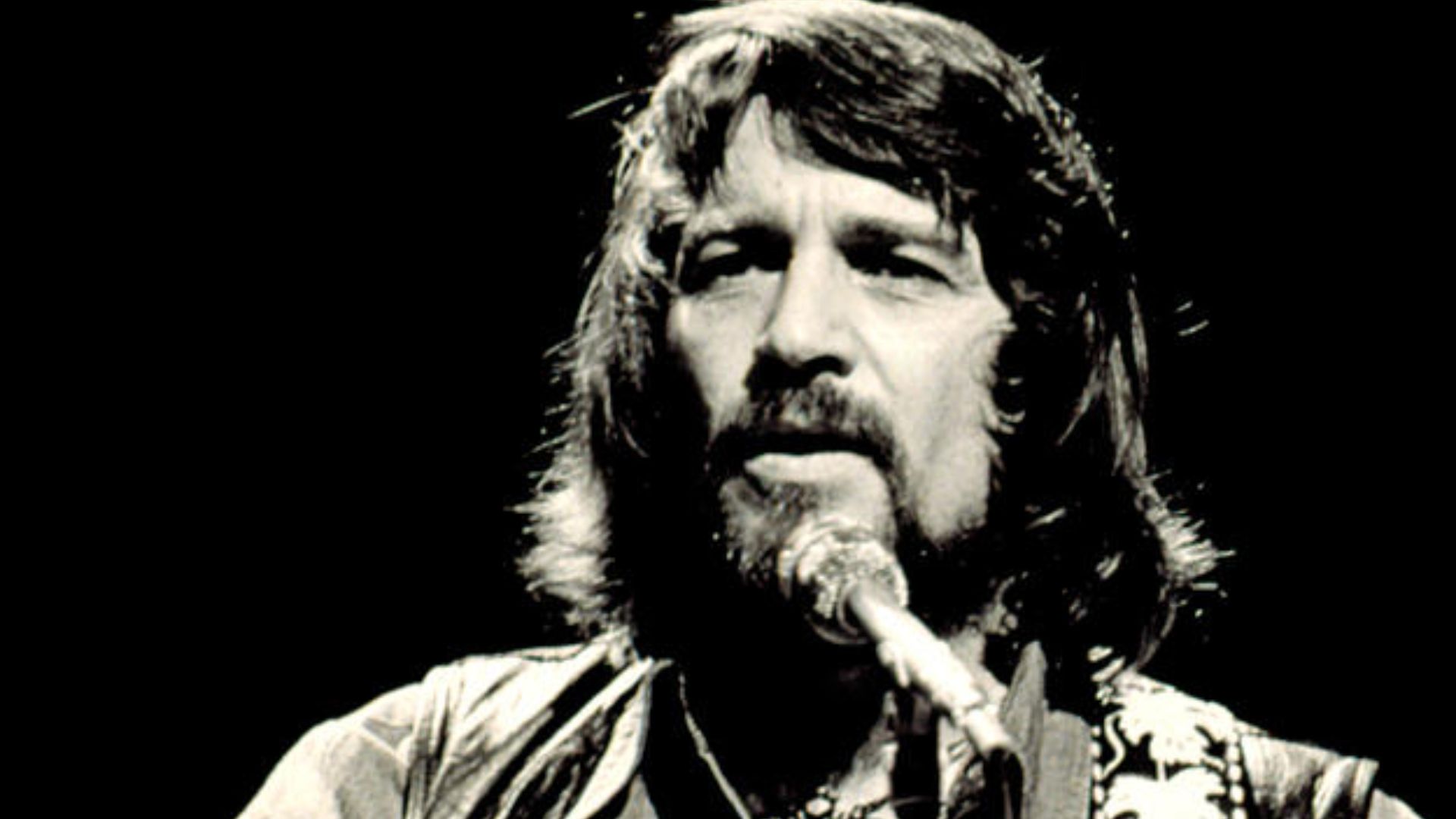 Waylon Jennings performing in concert