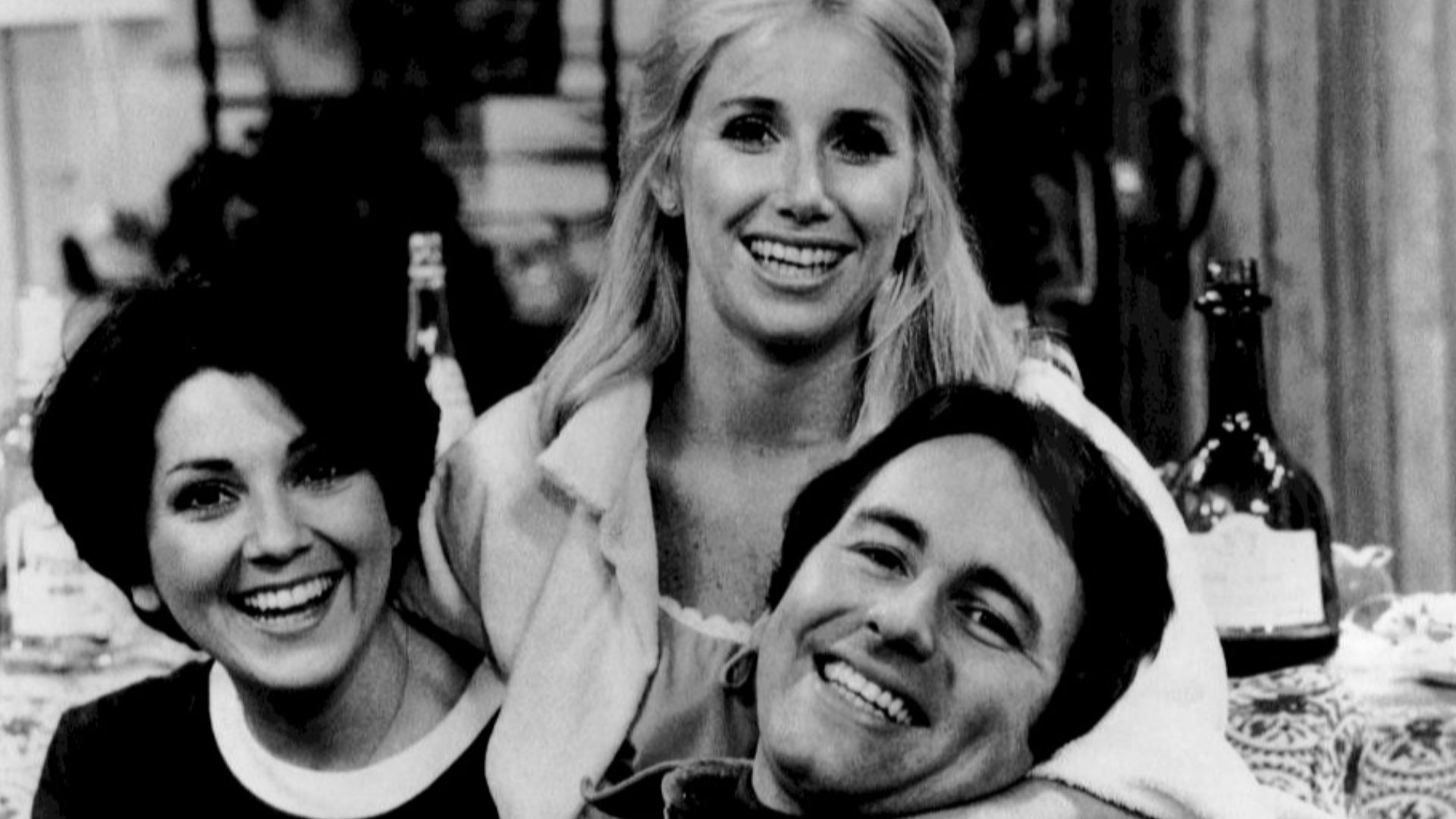 Publicity photo of the roommates from the television program Three's Company.  From left: Joyce DeWitt (Janet}, Suzanne Sommers (Chrissy), John Ritter (Jack).