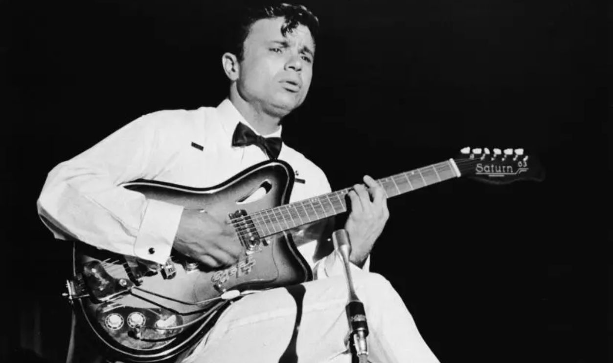 American actor Robert Blake plays electric guitar on stage, in a fantasy sequence from the film, 'In Cold Blood,' directed by Richard Brooks, 1967. (