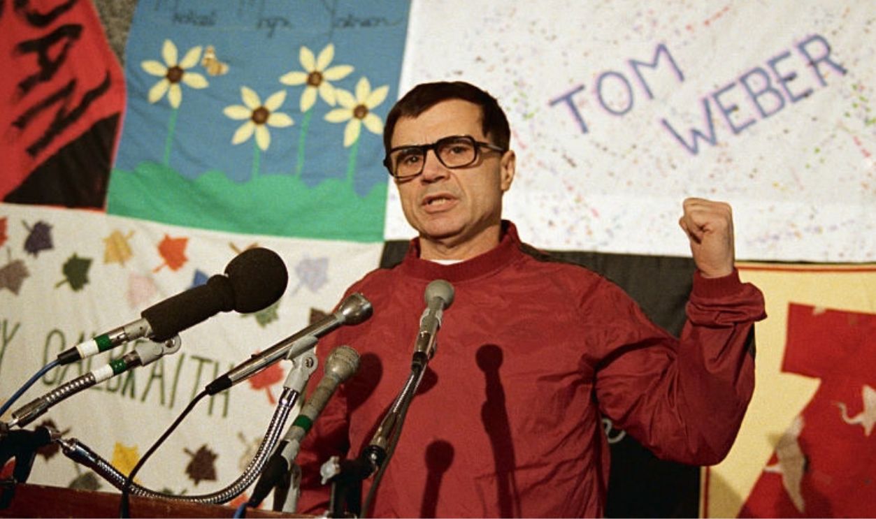 (Original Caption) Washington: Actor Robert Blake speaks to reporters, October 9th, at a press conference while standing in front of a quilt with the names of AIDS victims embroidered on it. The quilt, roughly the size of two football fields, is composed of separate three by five panels each bearing the name of a single AIDS victim.