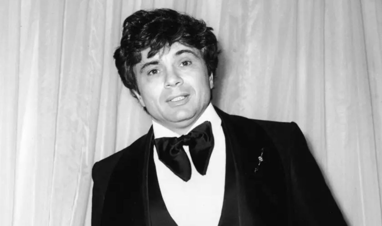 American actor Robert Blake stands at the Emmy Awards, holding a cigarette, Hollywood, California 1975. Blake won Best Actor for his role in the television series, 'Baretta.' 