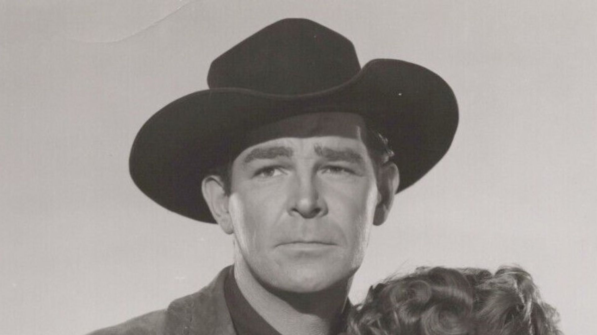 Randolph Scott and Jane Nigh in the American film Fighting Man of the Plains (1949) - publicity still (cropped).