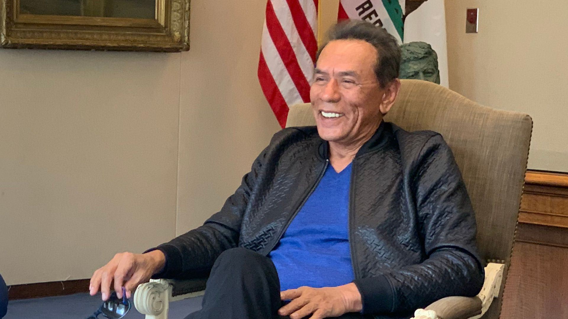Wes Studi visiting with Gavin Newsom on Native American Day.