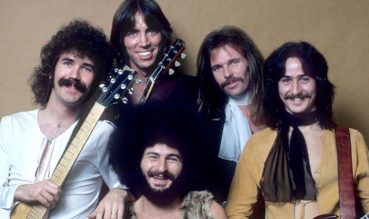 PROVIDENCE, RI - OCTOBER 7: The band BOSTON (l-r) Brad Delp, Tom Scholz, Sib Hashian, Fran Sheehan, Barry Goudreau pose for a portrait backstage at the Providence RI Civic Center on October 7, 1976 in Providence, Rhode Island. 