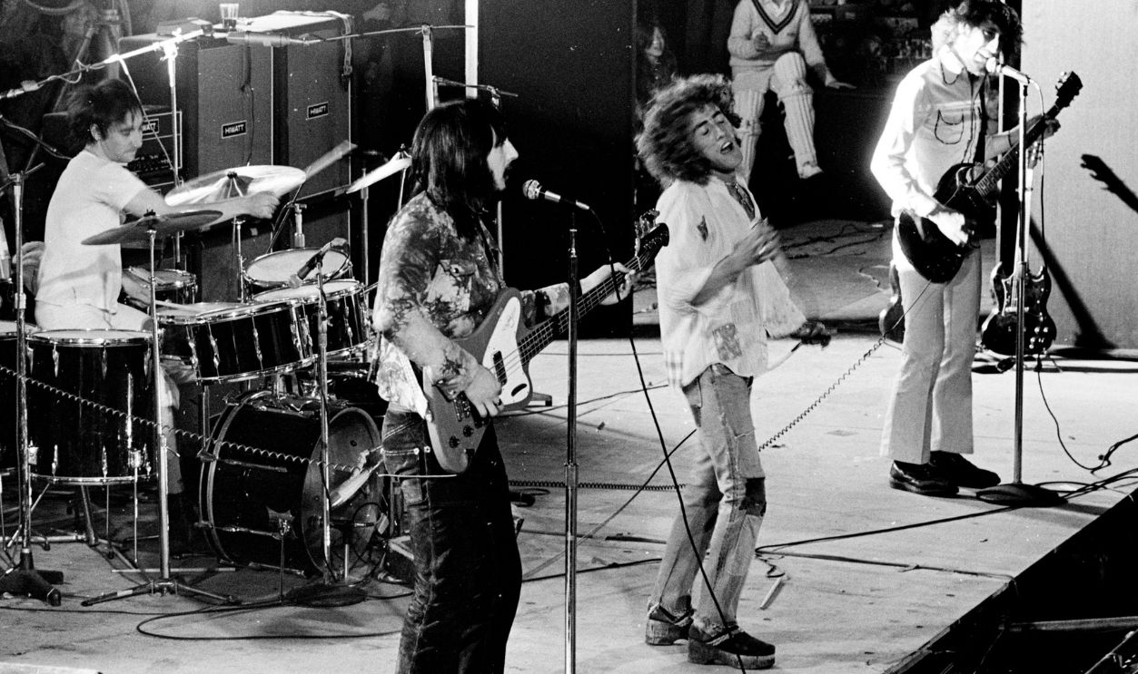 LONDON - SEPTEMBER 18: The Who perform live on stage at Oval Cricket Ground in London on September 18 1971 L-R Keith Moon, John Entwistle, Roger Daltrey, Pete Townshend