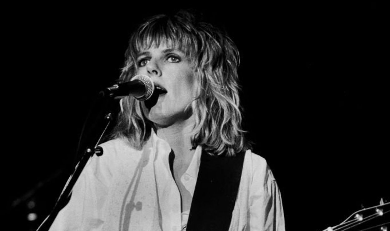 American Folk and Country musician Lucinda Williams plays guitar as she performs onstage at the Park West, Chicago, Illinois, September 20, 1992.