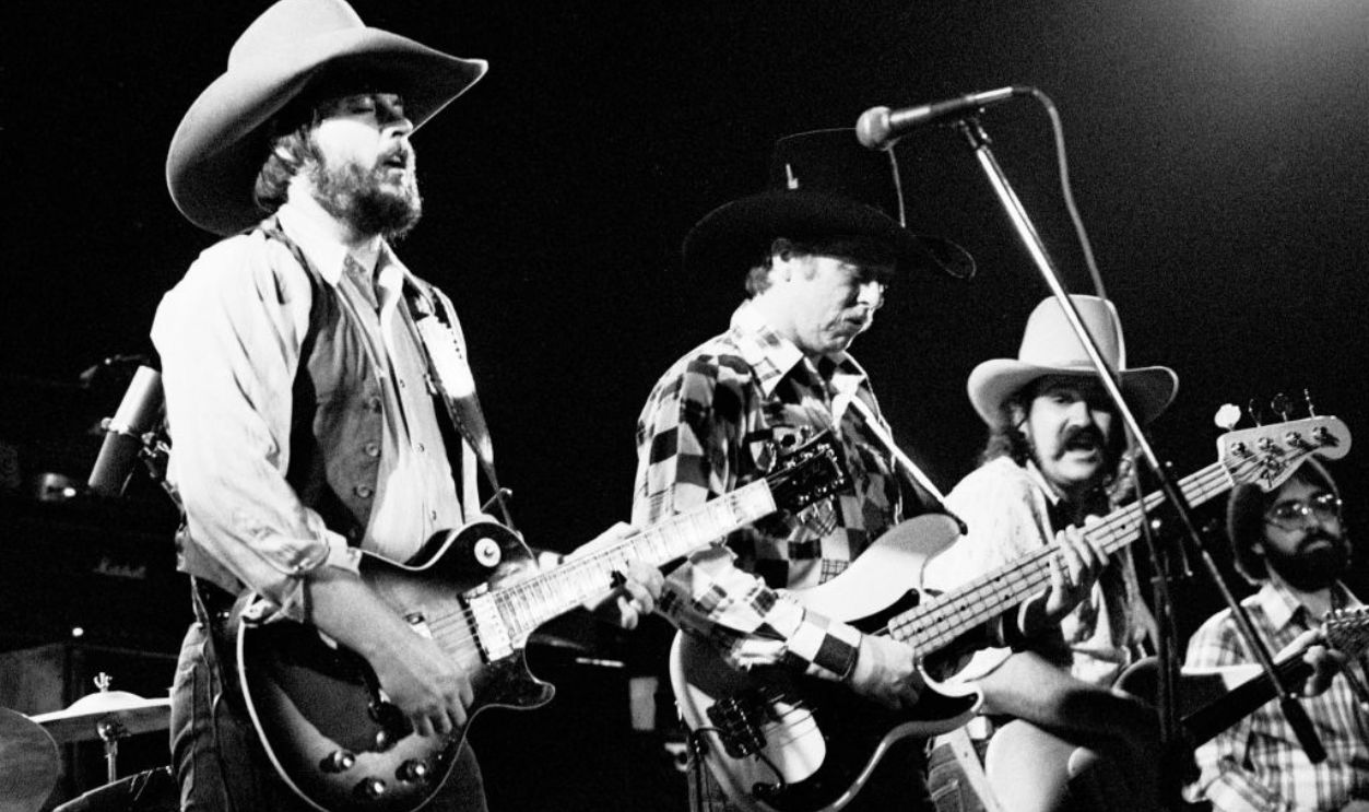 AMSTERDAM, NETHERLANDS - 1975: The Marshall Tucker Band perform live on stage in Amsterdam, Netherlands in 1975 L-R Toy Caldwell, Tommy Caldwell, George McCorkle