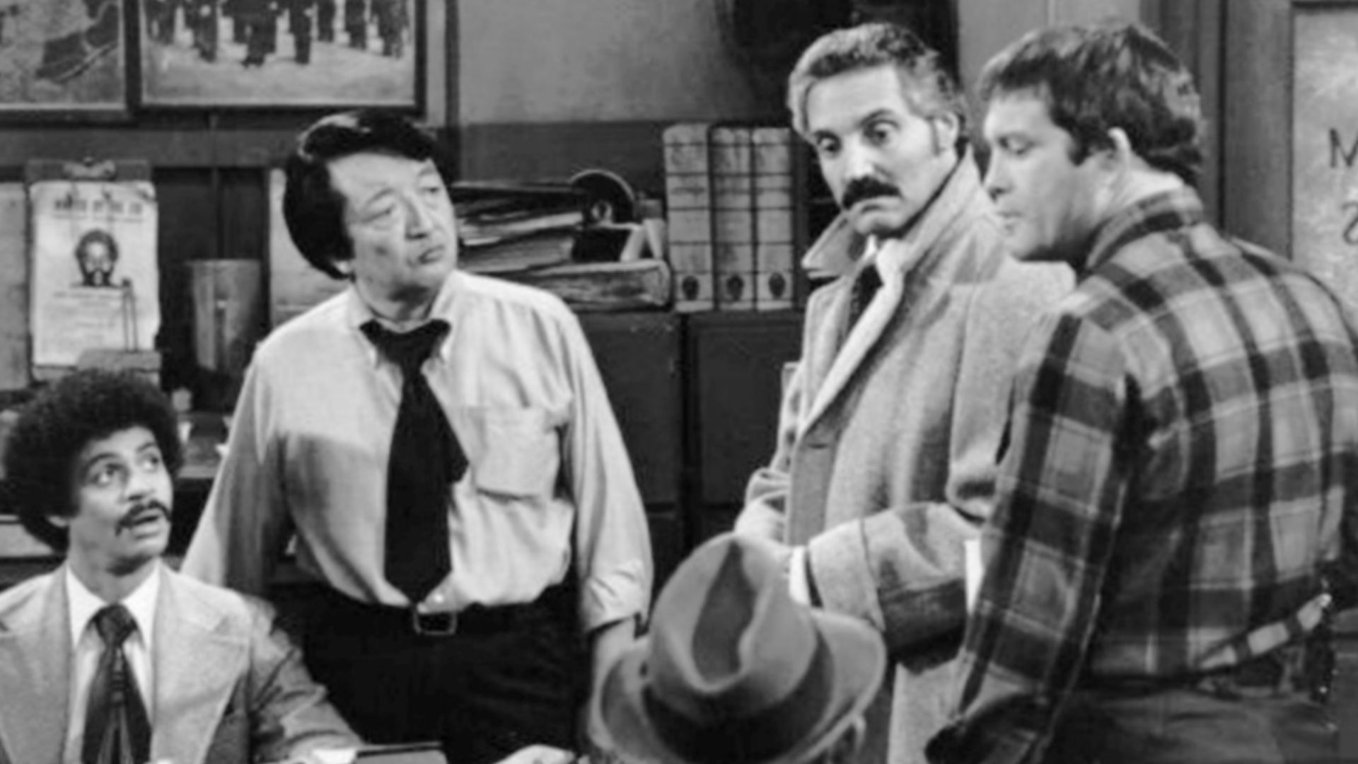 Cast photo from the television series Barney Miller Clockwise from left: Ron Glass (Ron Harris}, Jack Soo (Nick Yemana), Barney Miller (Hal Linden), Max Gail (