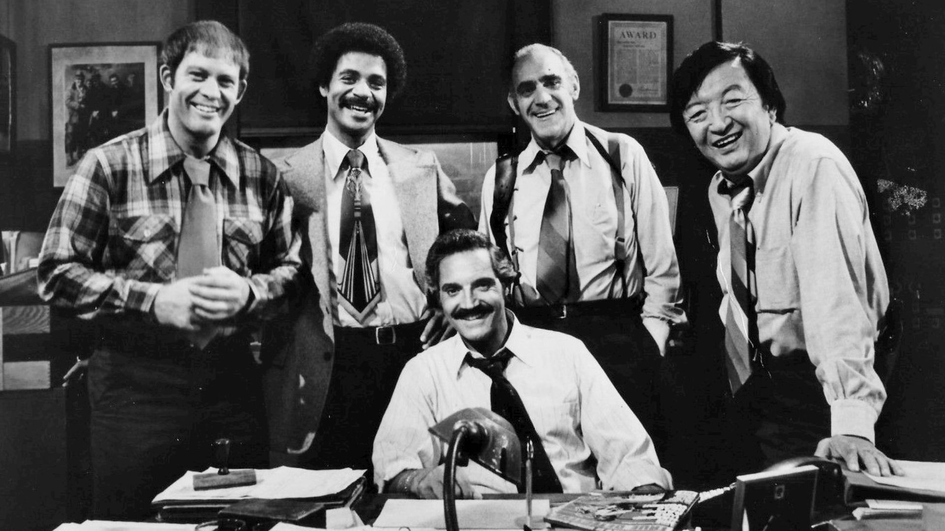 1977 cast photo from the television series Barney Miller.  From left: Max Gail (