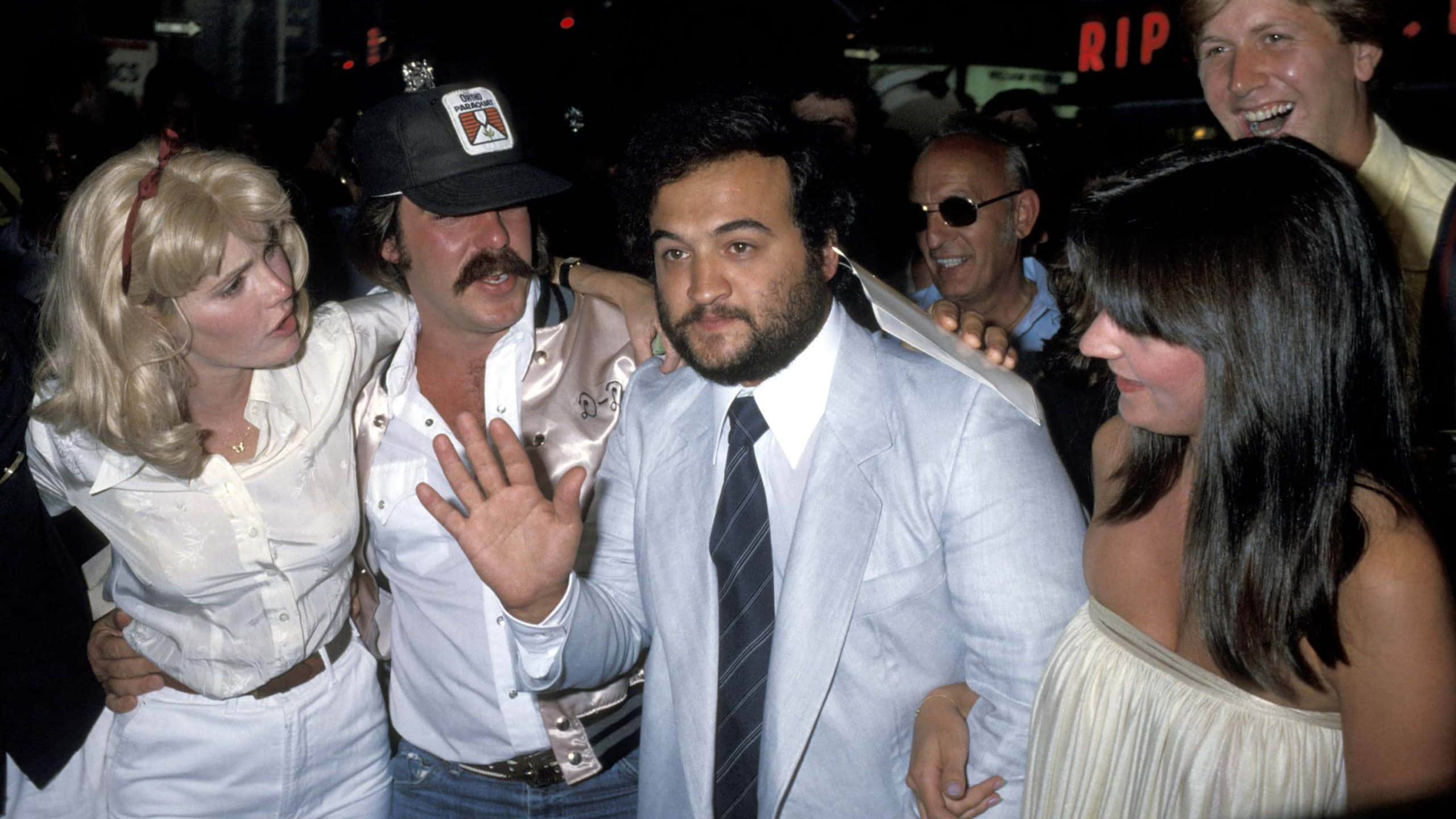 Mary Louise Weller, John Belushi, and wife Judy Jacklin (Photo by Ron Galella/Ron Galella Collection via Getty Images) *** Local Caption ***