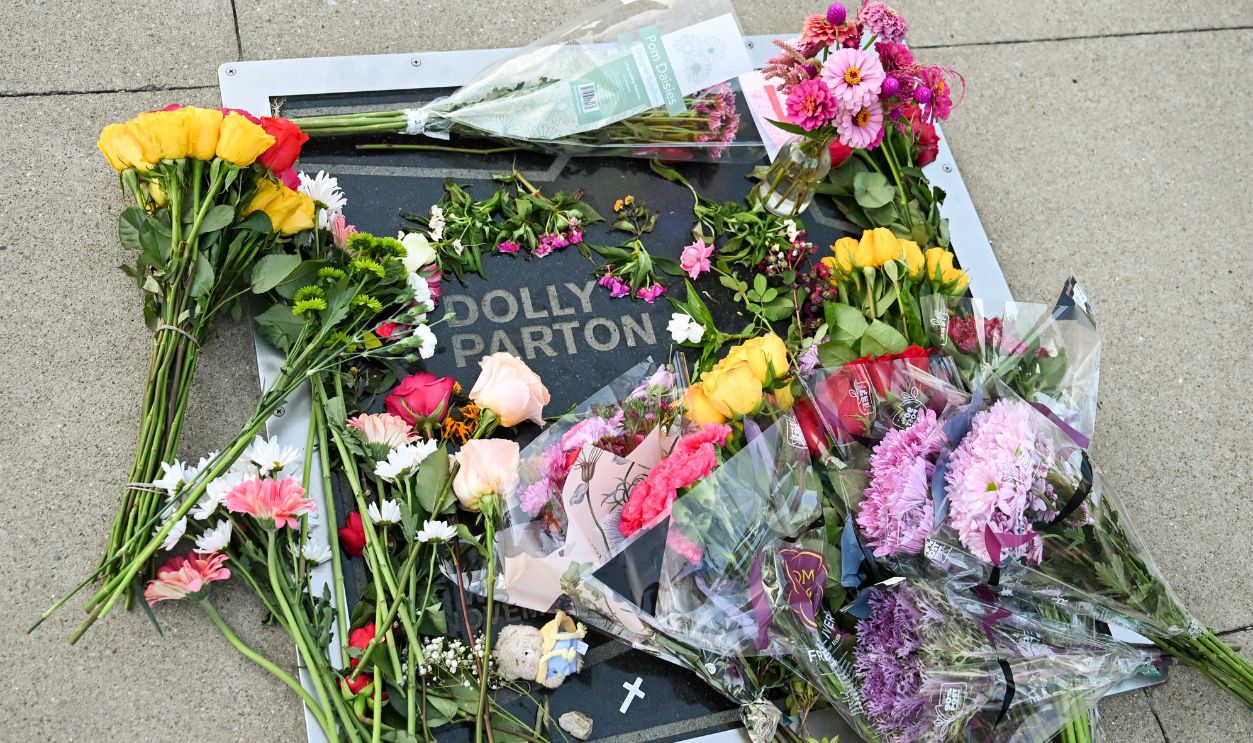 Getty Images - 2292060950 - Flowers are laid on Dolly Parton's star on The Music City Walk of Fame on August 25, 2026 in Nashville, United States. Parton passed away on August 25, 2026 at the age of 80. 