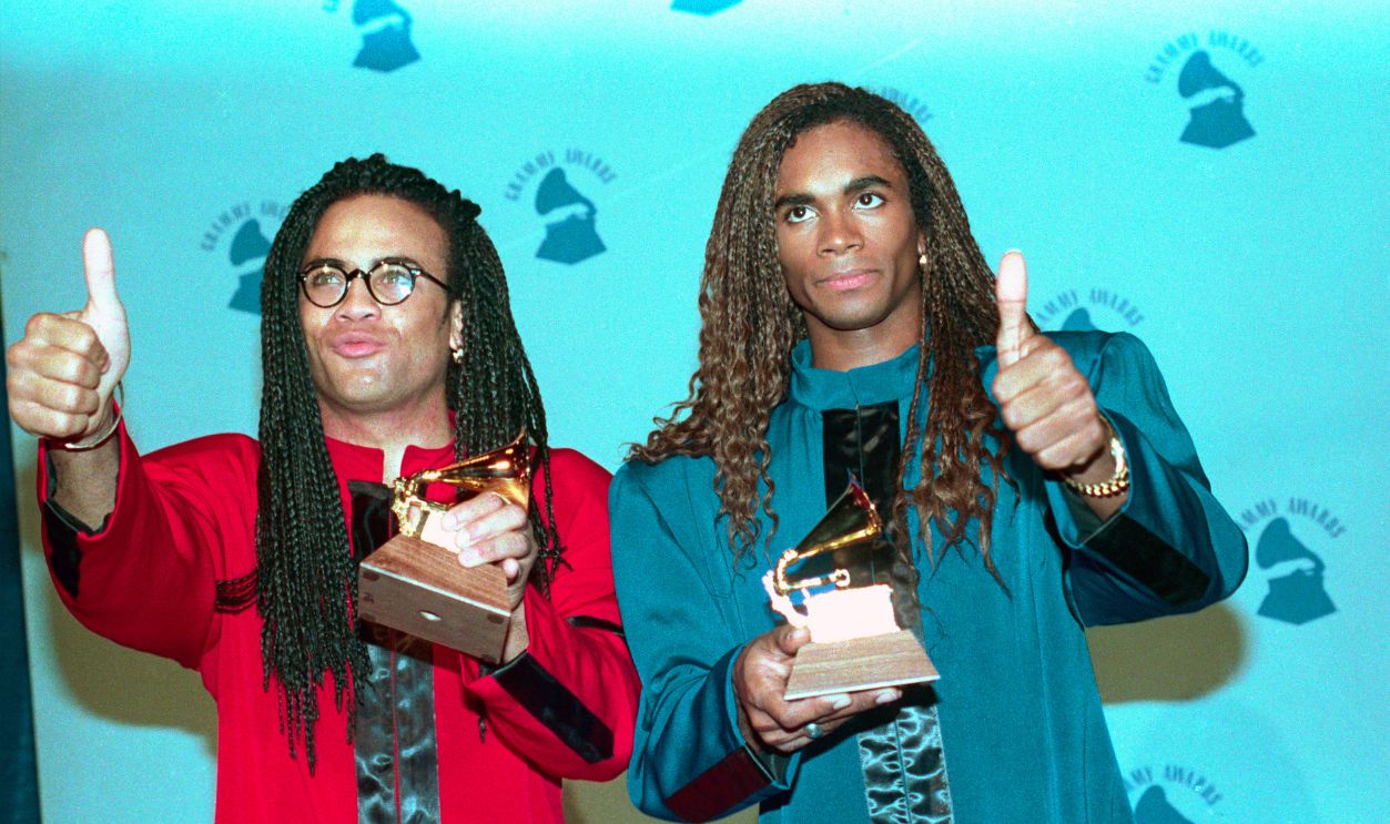 Milli Vanilli Posing with Grammy Award