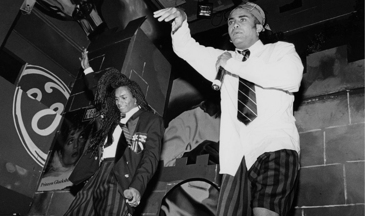 Milli Vanilli perform live, as Liz Smith looks on (left) in the 1990s in New York City, New York.