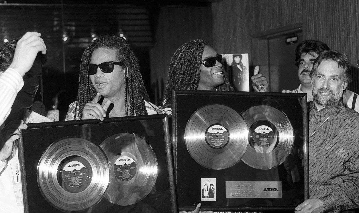 Milli Vanilli (Fab Morvan, Rob Pilatus) are shown receiving several awards backstage when they perform as part of the Club MTV Tour at the Brendan Byrne Arena on July 23, 1989 in East Rutherford, New Jersey. 