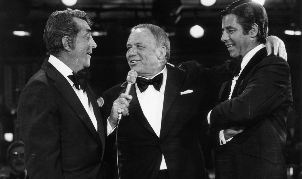L-R: American actors and singers Dean Martin (1917 - 1995) and Frank Sinatra, and American actor and comedian Jerry Lewis perform on stage during the eleventh annual Jerry Lewis telethon for muscular dystrophy research, Las Vegas, Nevada. 
