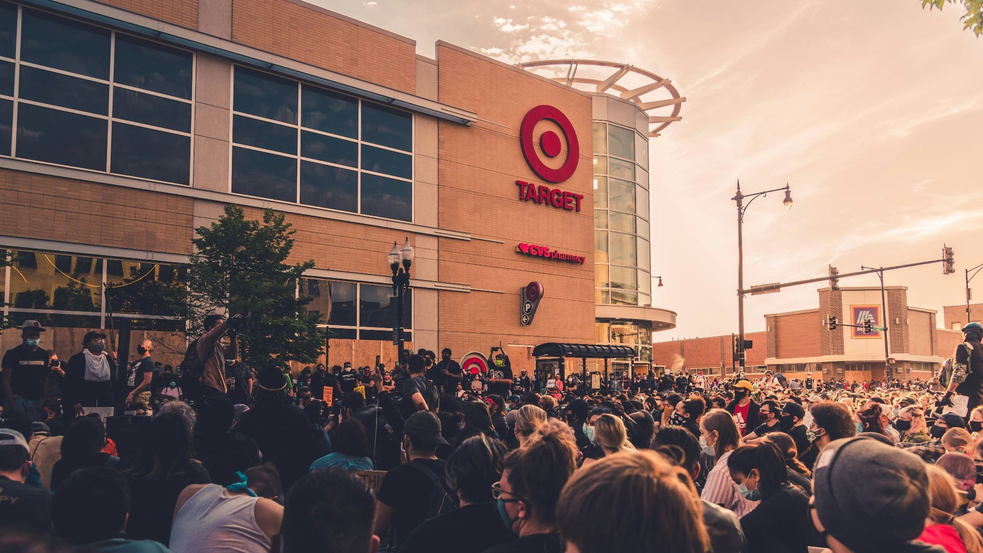 people gathering in front of brown building during daytime