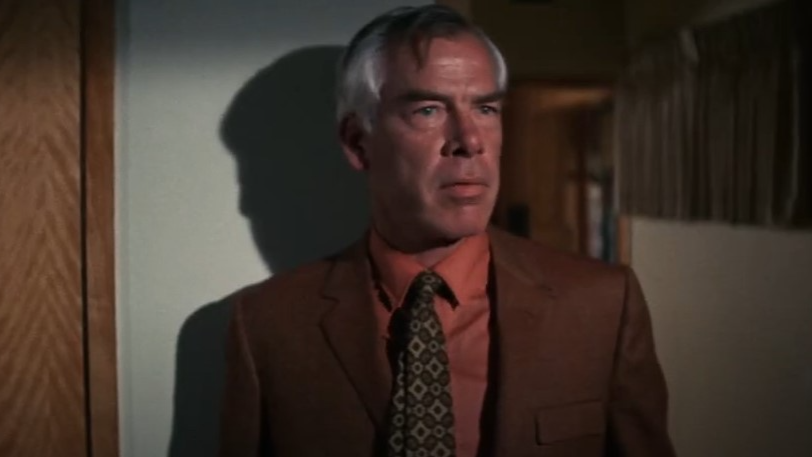 Lee Marvin in  Point Blank wearing brown suit