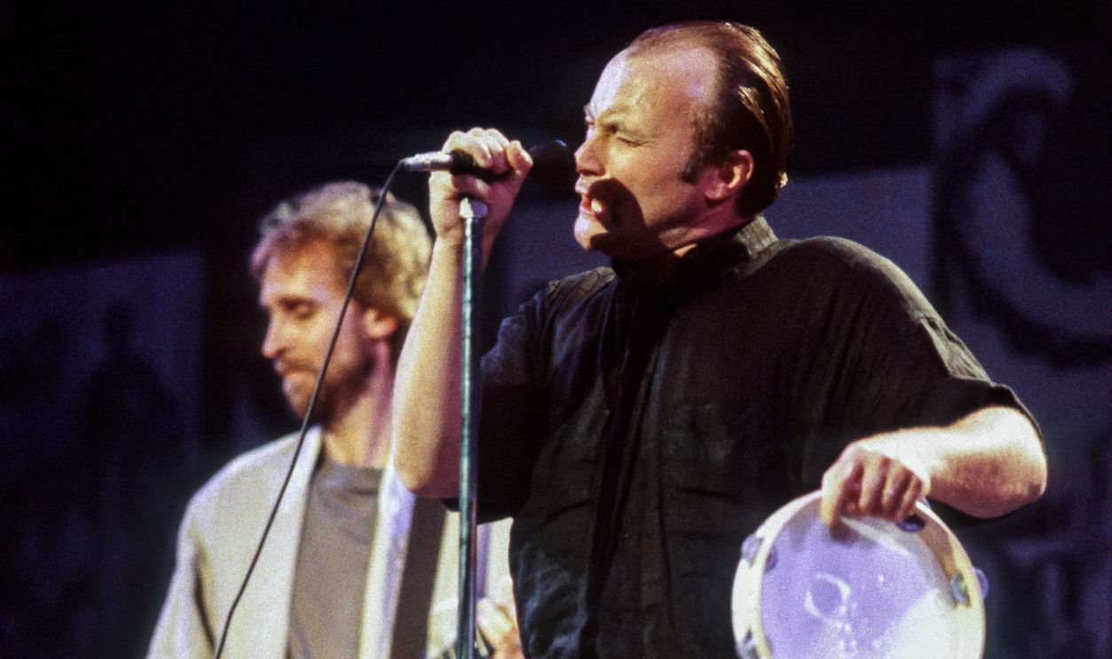 Guitarist Mike Rutherford and singer Phil Collins of the band Genesis perform during the Atlantic Records 40th Anniversary celebration called 