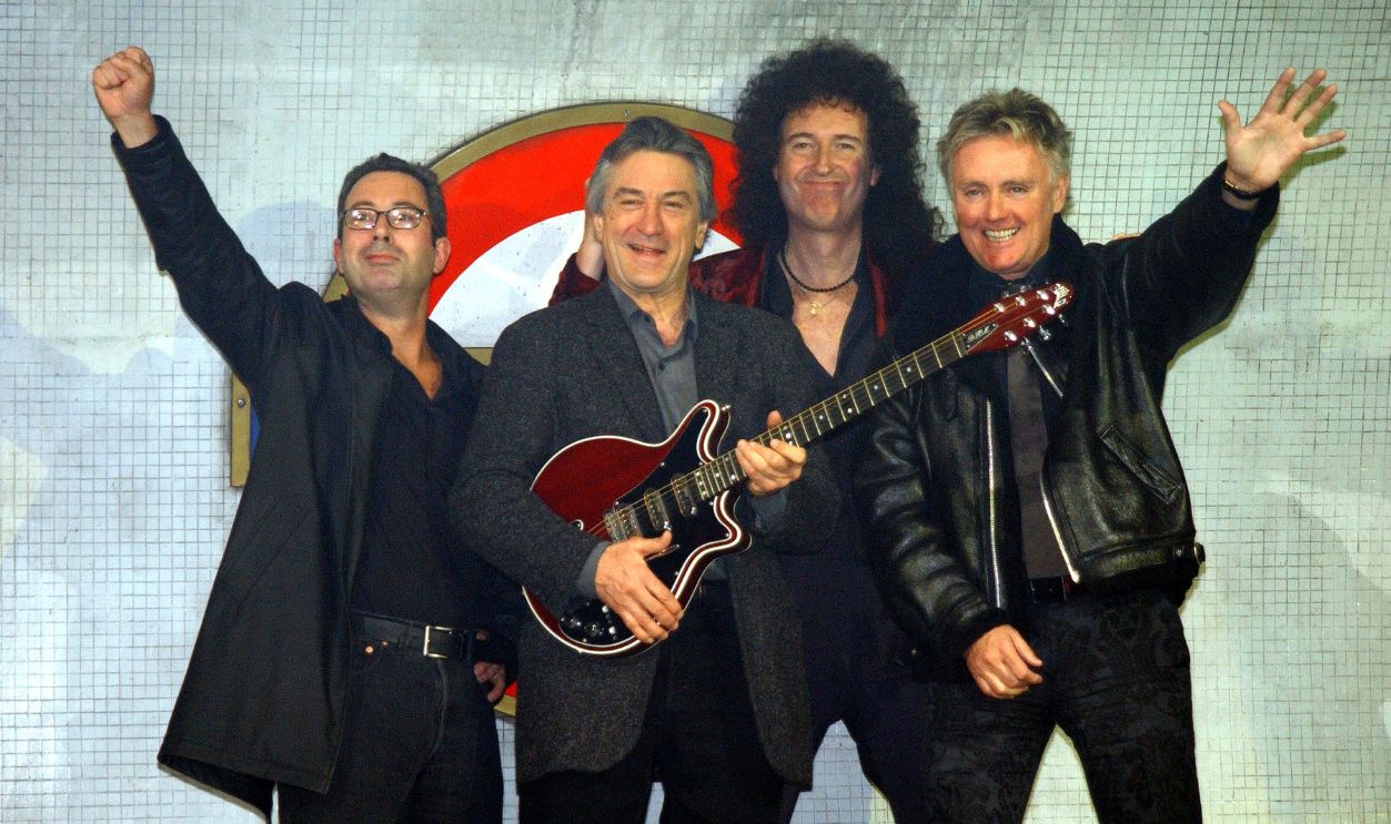 402867 13: Comedian Ben Elton, actor Robert de Niro, Brian May and Roger Taylor (L to R) pose for photographers March 26, 2002 during a press conference to promote 