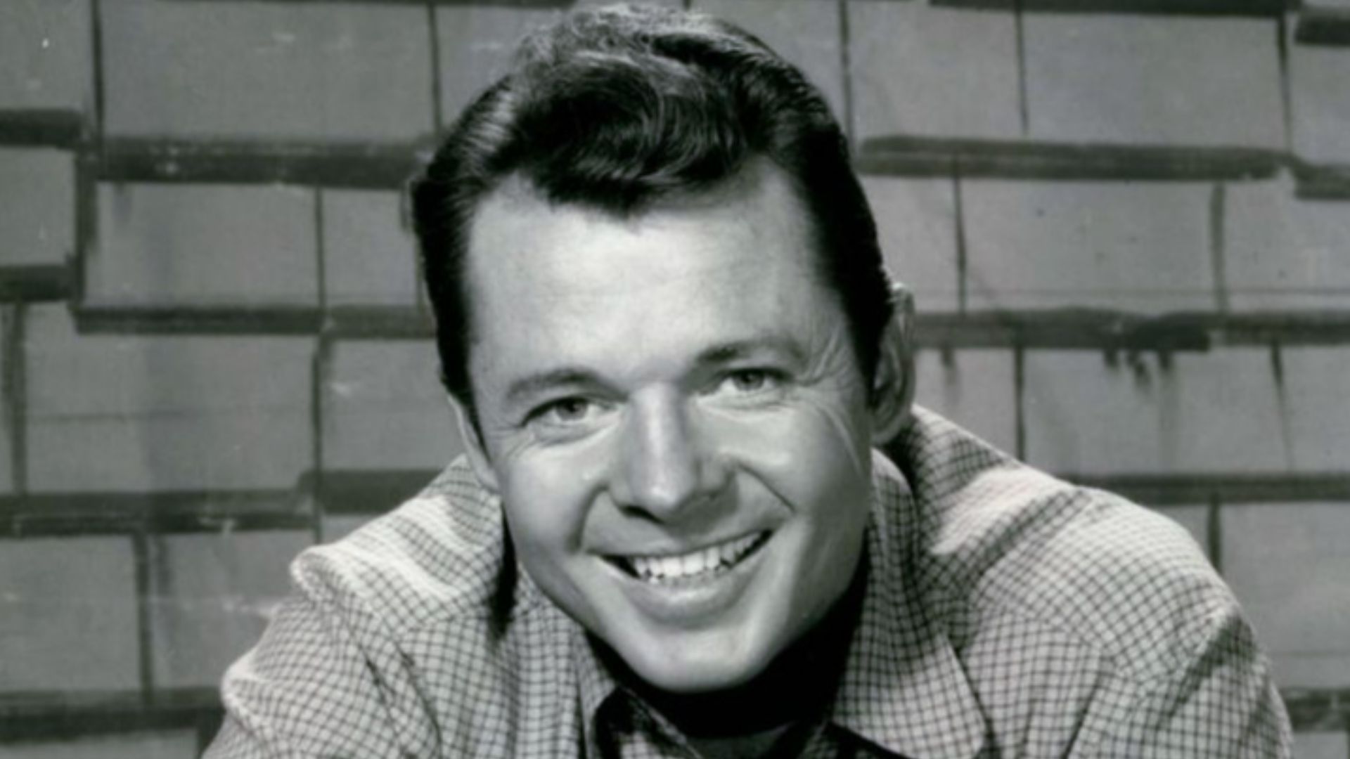 Photo of Audie Murphy as Tom Smith from the television program Whispering Smith.