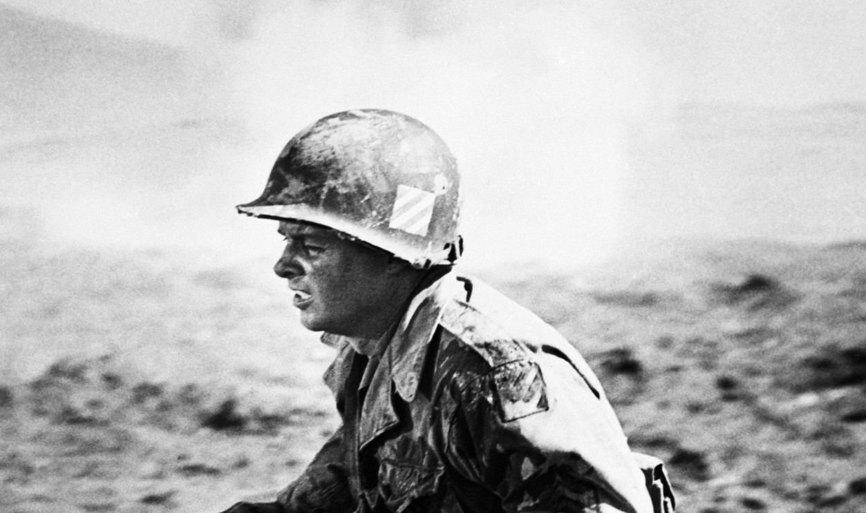 Getty Images - 517725304 - Audie Murphy, the most decorated war hero in the history of the United States reenacts some of his experiences in the European Theater of WWII in this scene from the upcoming movie To Hell And Back, an adaptation of his autobiography of the same name. Audie served 390 days in the front lines in Anzio, Sicily, France, the Rhine, the Colmar pocket, Nuremberg and Salzberg. He received 24 decorations in all including the Congressional Medal of Honor.