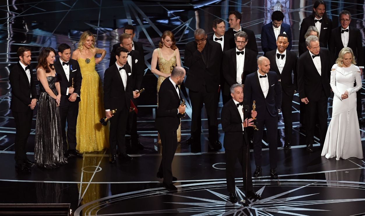 645746932 'La La Land' producers Marc Platt (speaking at microphone), Jordan Horowitz and Fred Berger