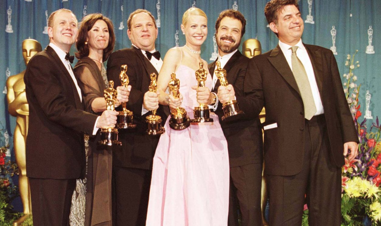 830151608 David Parfitt, Donna Gigliotti, Harvey Weinstein, Gwyneth Paltrow, Edward Zwick and Marc Norman all celebrate after receiving the Oscar for best picture for 