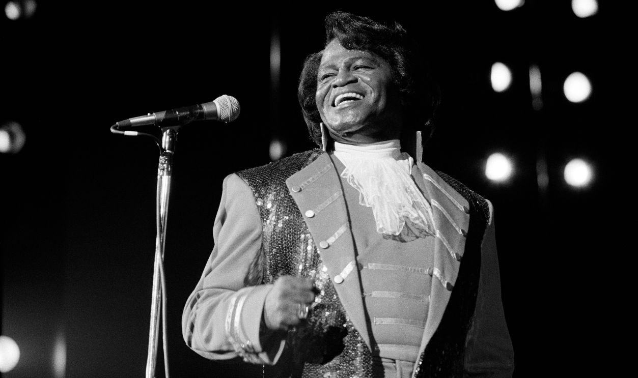 American R&B, Funk, and Soul singer James Brown (1933 - 2006) smiles as he performs onstage at the Paramount, New York, New York, February 28, 1992.