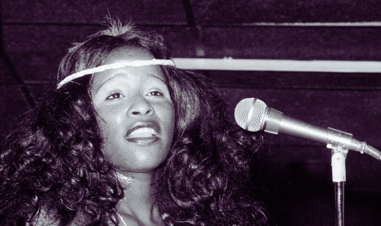 Singer Chaka Khan performing with American funk group Rufus at a record launch party in London, February 1975. On the left is bassist Dennis Belfield.