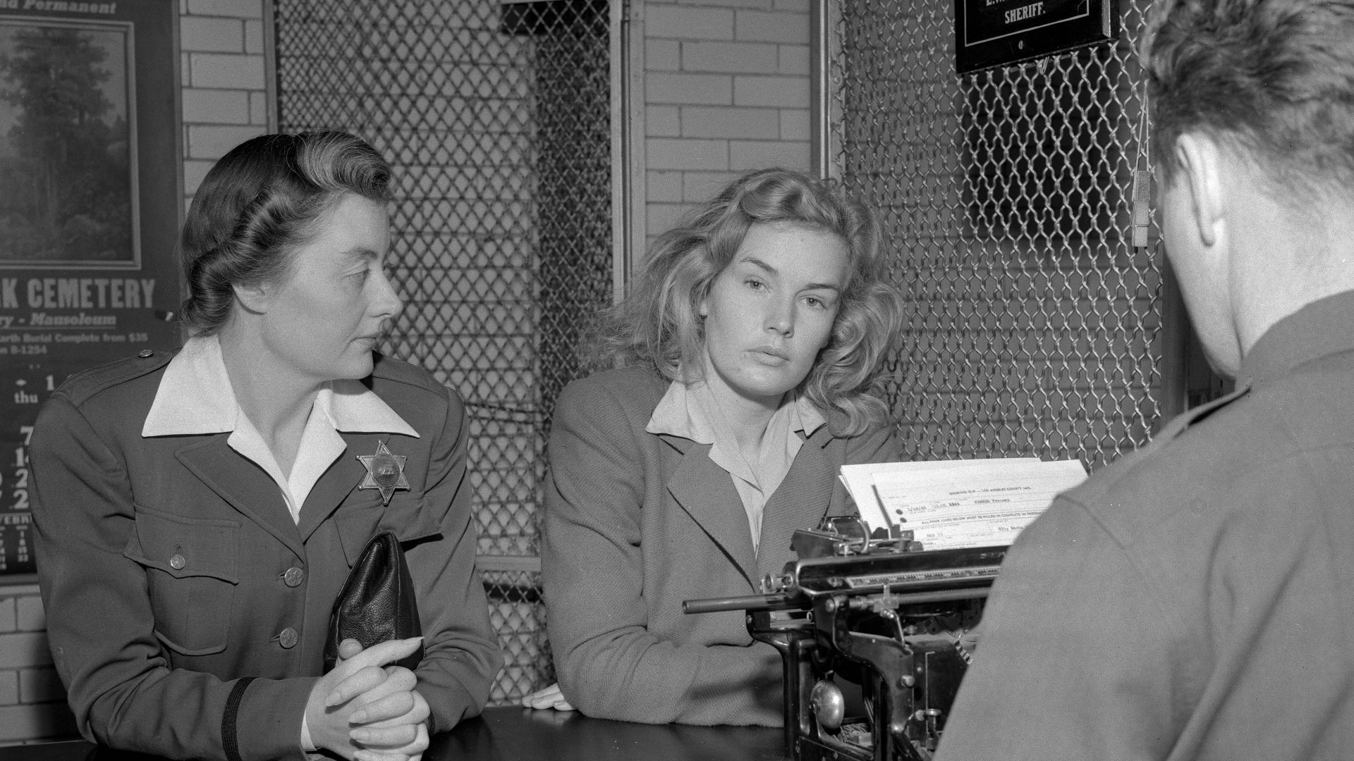 File:Frances Farmer being booked by sheriff.jpg