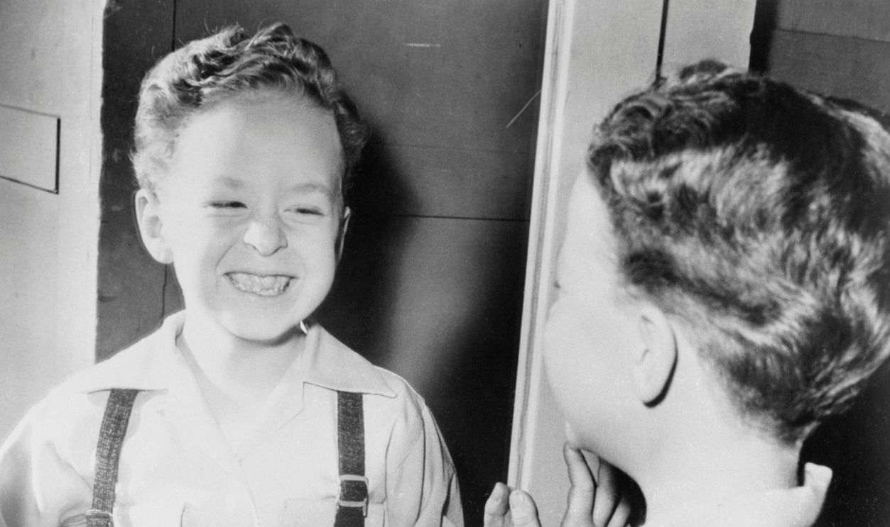 Getty Images - 517367816 - Child actor Rusty Hamer Looking in Mirror, who starred as the son of Danny Thomas on the 1953-65 television series Make Room for Daddy.