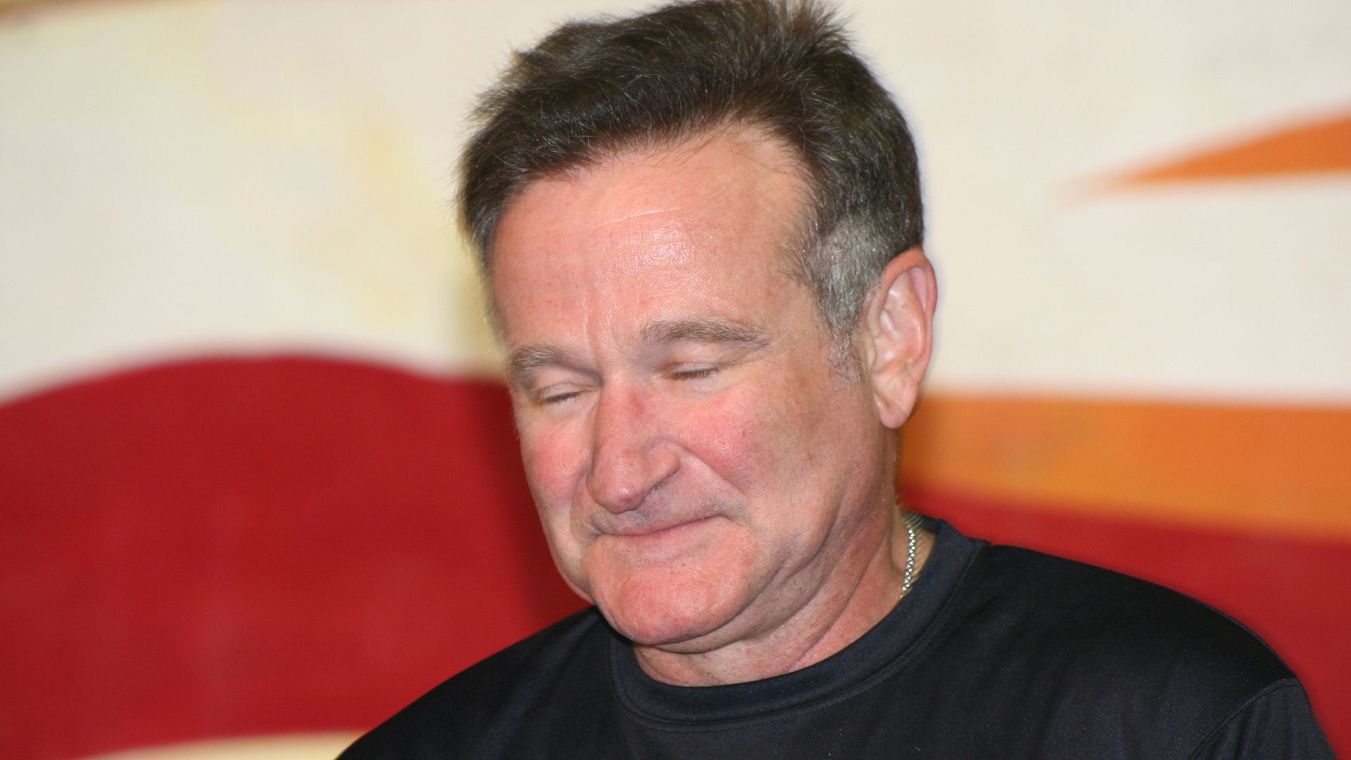 Robin Williams, Academy Award winning actor and comedian, takes a pause from the laughter and antics as he performs on stage at the Contingency Operating Base Speicher. Williams performed for troops at Speicher during a brief USO stopover at the base, Dec. 19. Williams was among several celebrities participating in the tour, to include Rachel Smith, Lance Armstrong, Lewis Black and Kid Rock.