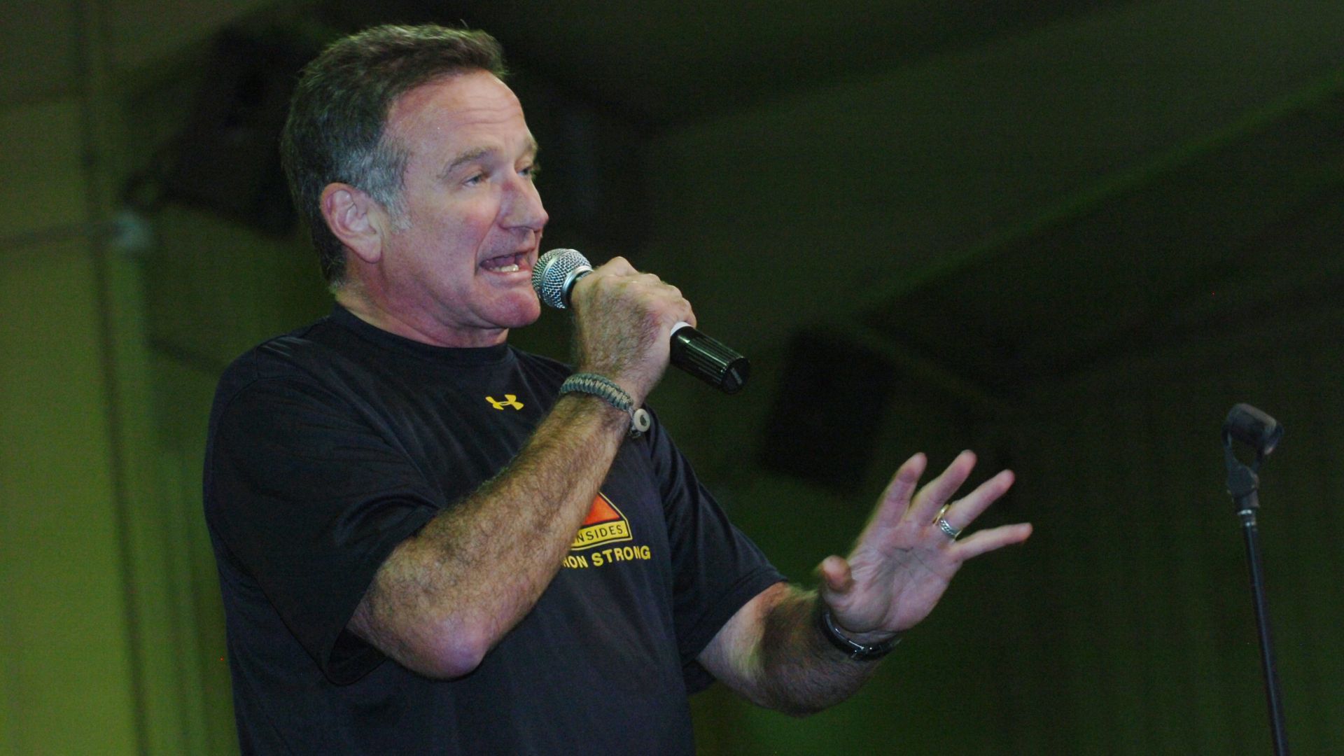 Robin Williams, Academy Award winning actor and comedian, entertains the troops at Contingency Operating Base Speicher main gym, Dec. 19. The hour-long show at COB Speicher was one stop on a USO tour that also included singer Kid Rock, biker Lance Armstrong, 2007 Miss U.S.A. Rachel Smith and Grammy Award stand-up comedian Lewis Black.