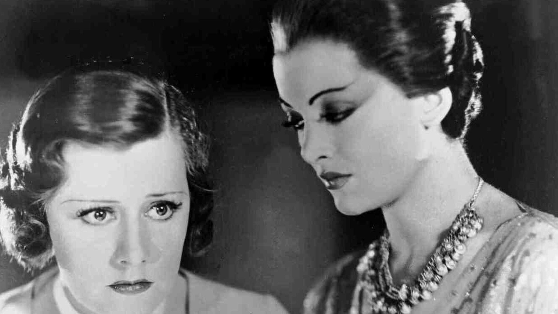 Irene Dunne and Myrna Loy in a promotional still for Thirteen Women (1932)