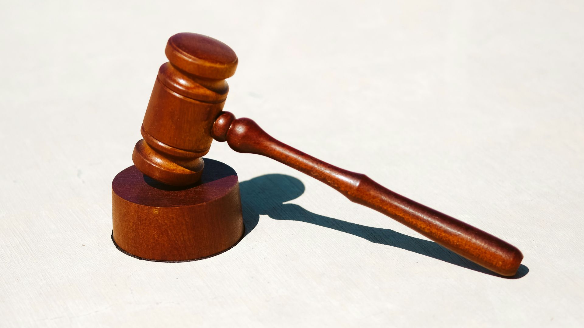 brown wooden tool on white surface